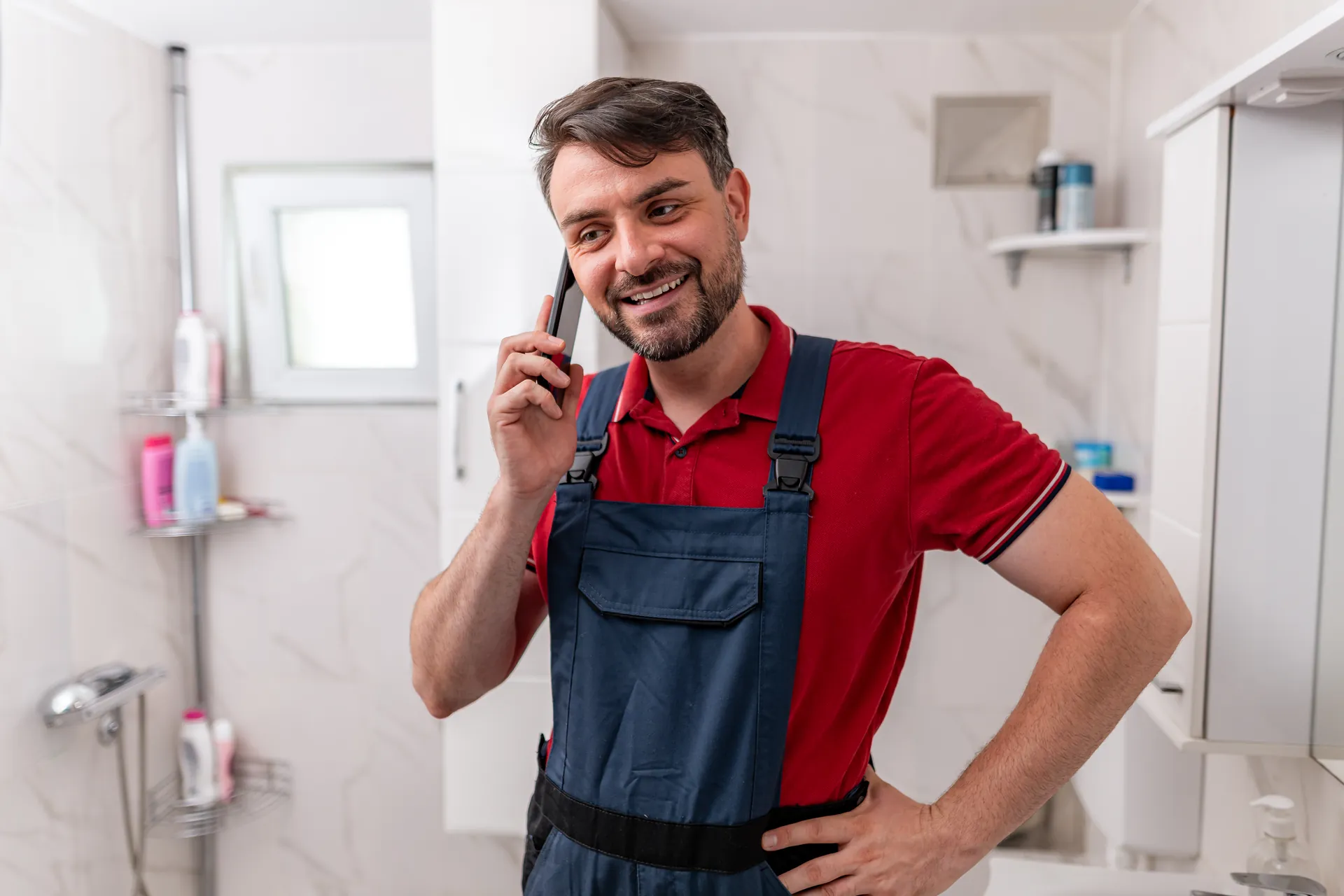 Plumber answering a customer phone call
